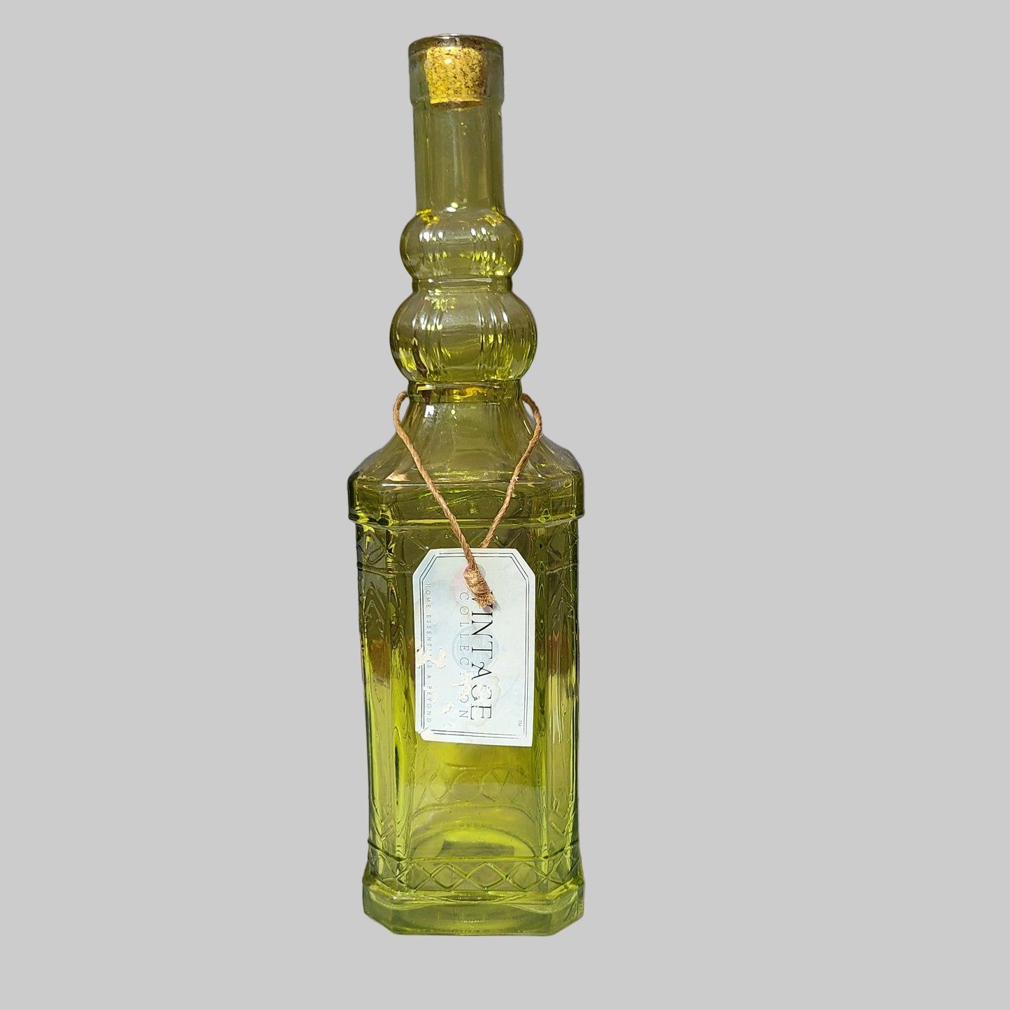 Vintage Collection Yellow Embossed Glass Bottle - USED