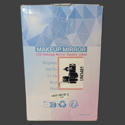 Makeup mirror packaging with geometric design on a gray surface